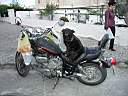 P4090057.JPG: Man with bike and dog on gas tank. Dog sat on seat when driver pointed at it and left for groceries
